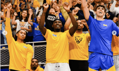 From left to right: Pitt basketball players Jaland Lowe, Marlon Barnes, Papa Amadou Kante, Ishmael Leggett, and Guillermo Diaz Graham at the Pitt volleyball game.